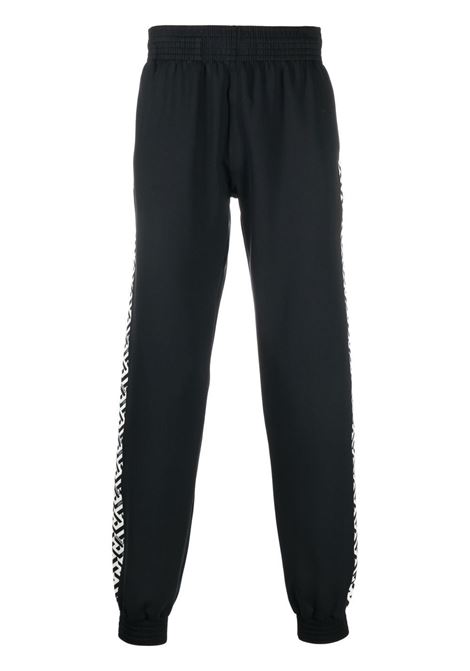 pantalone sportivo nero con banda laterlae in stampa La Greca VERSACE | 1002101-1A016232W020
