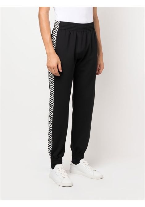 pantalone sportivo nero con banda laterlae in stampa La Greca VERSACE | 1002101-1A016232W020